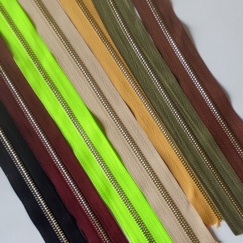 Молния металлическая №5 рулонная двухстороняя полированные зубья под золото Цена за 10 см Молния металлическая №5 рулонная двухстороняя полированные зубья под золото Цена за 10 см