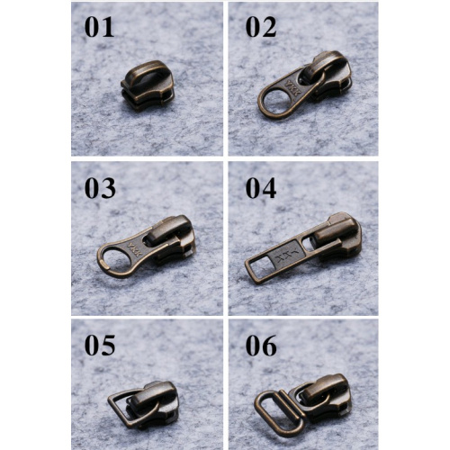 Бегунок, зажимы, ограничители для молнии №5 YKK под бронзу фото 2